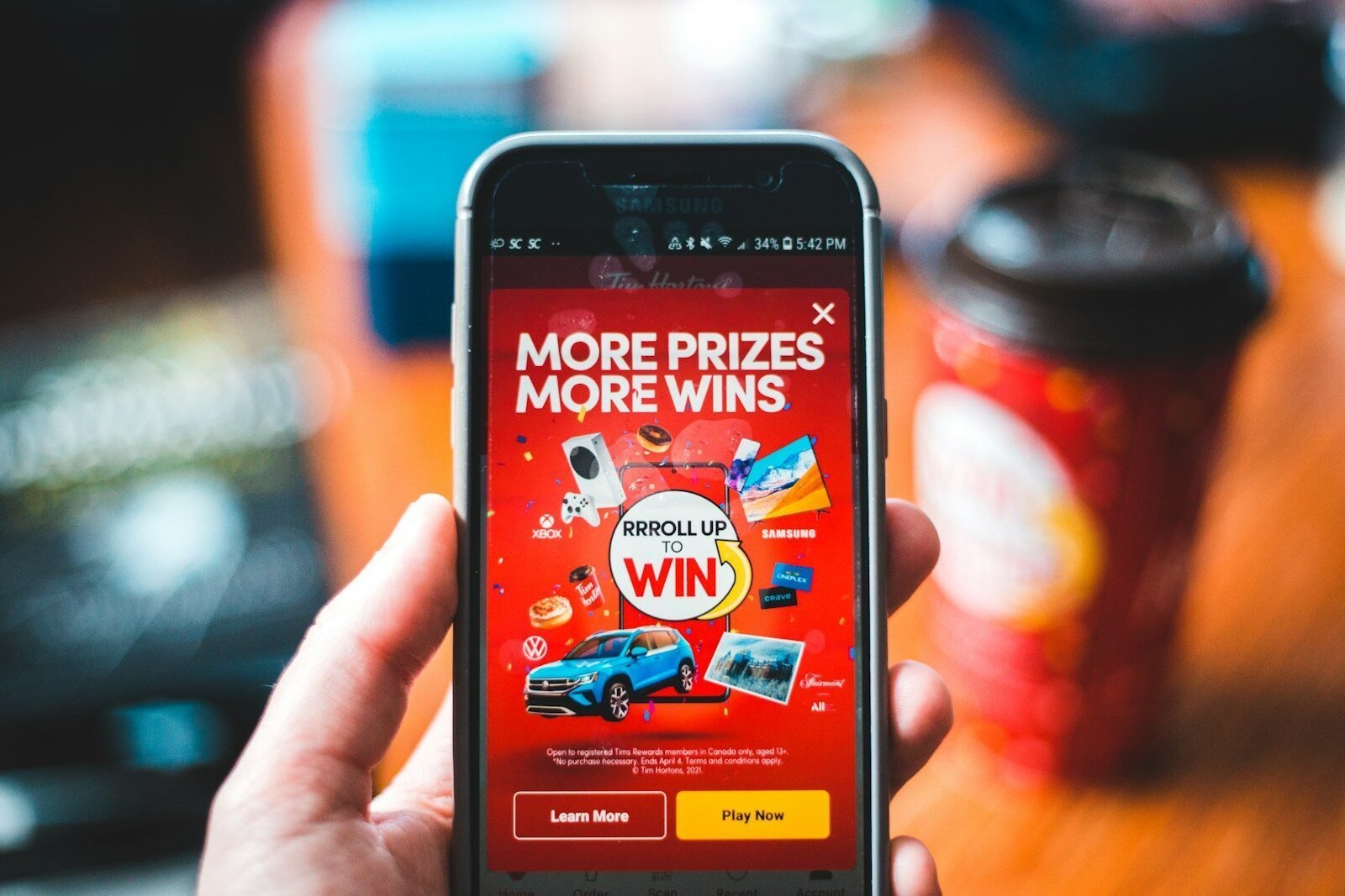 red and black smartphone showing game application