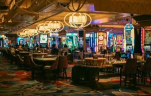 A casino interior with slots and tables is shown.